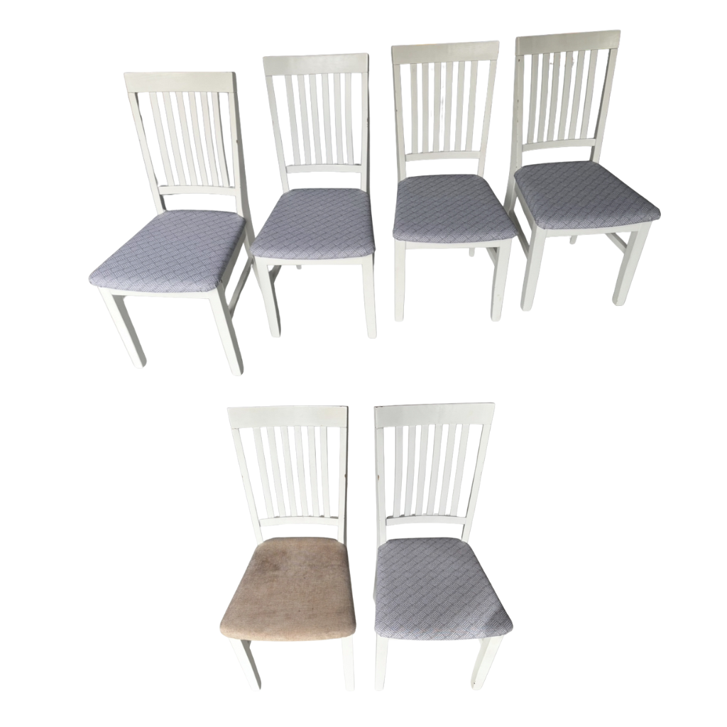 Set of six white chairs with Native Cinza patterned seat covers.