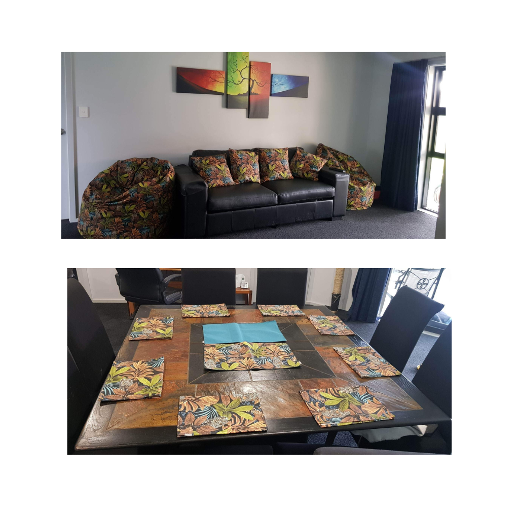Living room with a black sofa with our Savanna Gold cushions, Savanna Bean Bags and a dining table with Savanna placemats.