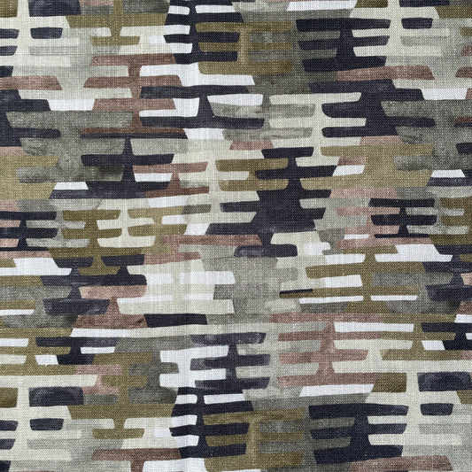 Rhythem Patterned fabric with geometric design in brown, beige, black, and white.