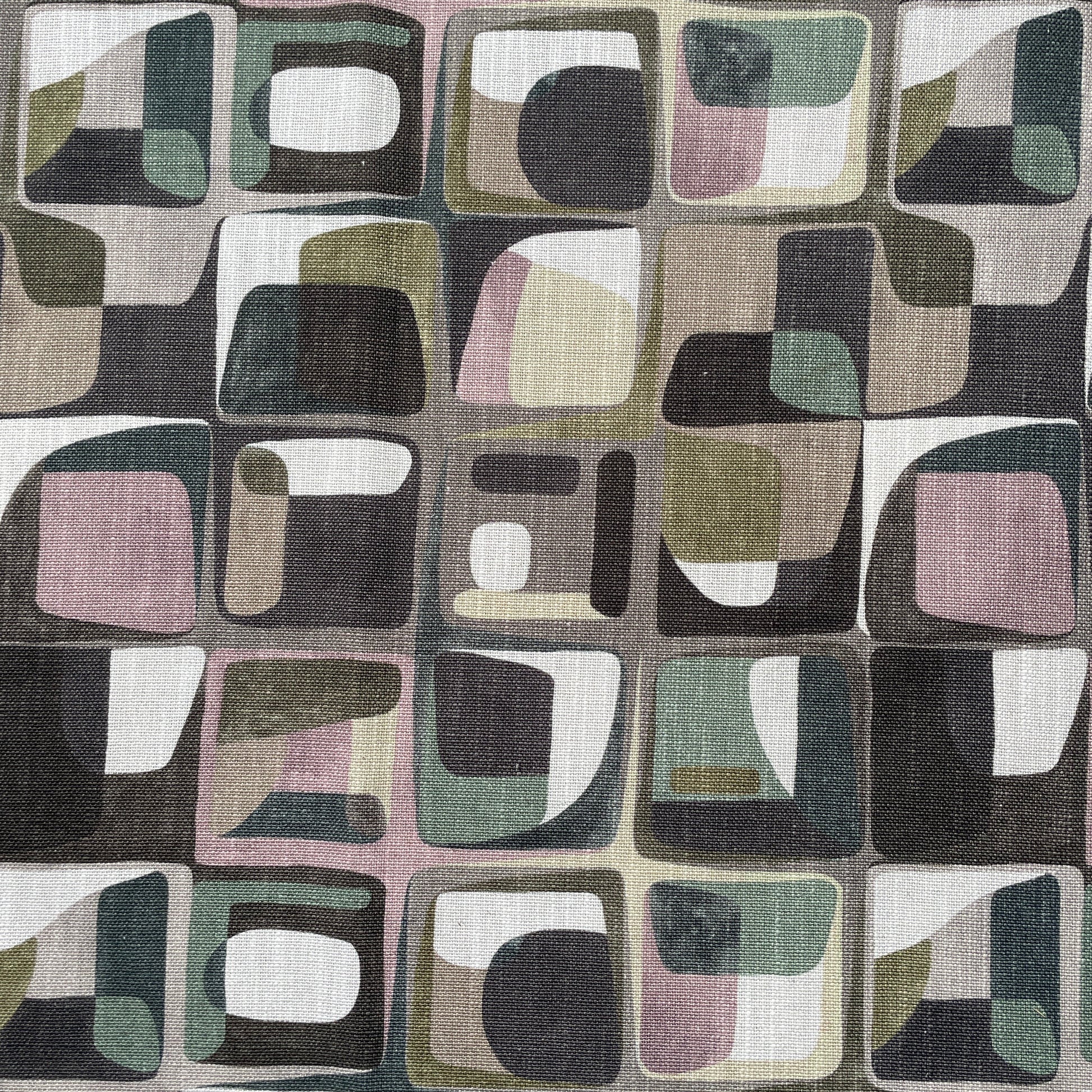 Patterned fabric with geometric shapes in brown, green, and beige.
